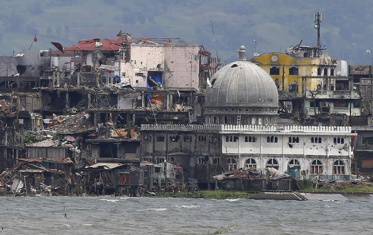 A mosque with its dome blasted out with holes is seen at the battle-scarred Marawi city in southern Philippines Thursday, Oct. 19, 2017. Two days after President Rodrigo Duterte declared the liberatio