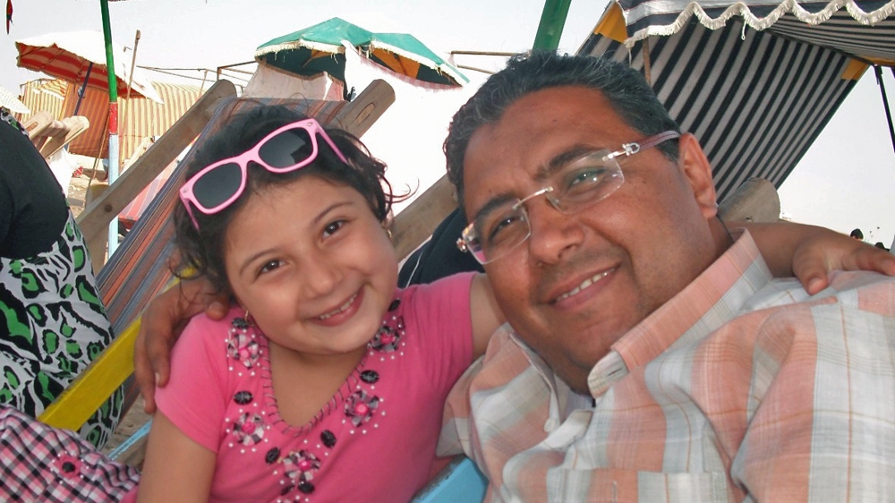Mahmoud Hussein on holiday with one of his daughters [Courtesy: Zahra Hussein]