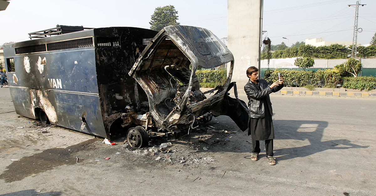 Police retrieve their motorcycles which were burned during clashes with protesters near the Faizabad junction in Islamabad, Pakistan November 26, 2017. REUTERS/Caren Firouz