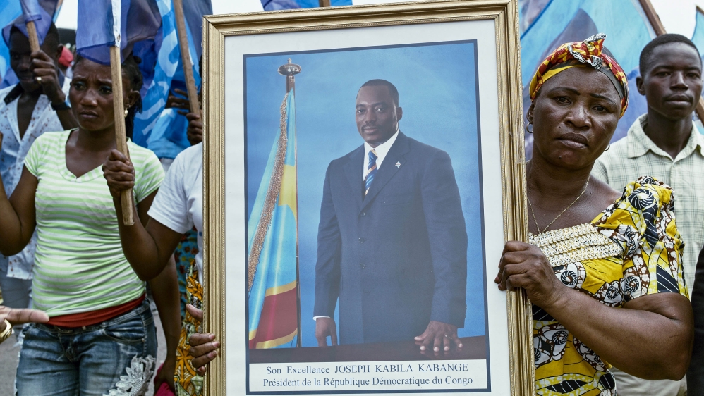 Civilians gather as they listen to the Democratic Republic of Congo''s President Joseph Kabila addressing the nation outside Palais du Peuple in the capital Kinshasa