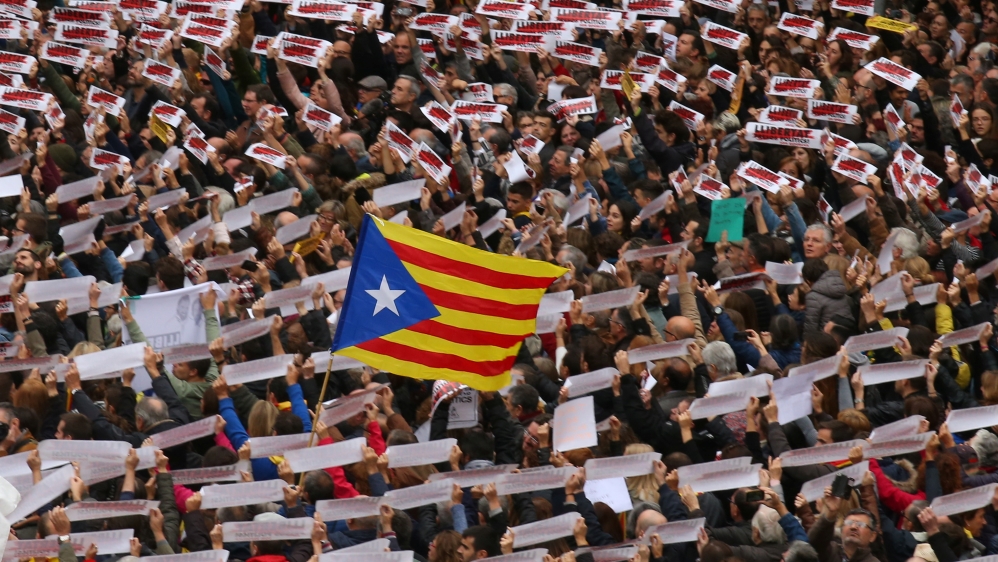 Protesters gather in Sant Jaume square at a demonstration during a partial regional strike in Barcelona