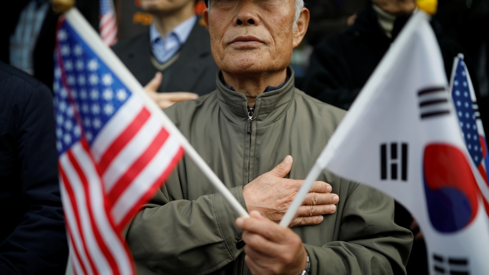 Protesters from a conservative civic group take part in a pro-Trump rally in central Seoul