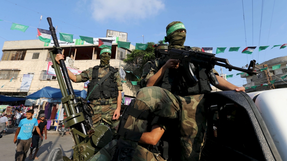 Palestinian members of the al-Qassam Brigades, the armed wing of the Hamas movement, take part in an anti-Israel parade in Rafah, southern Gaza Strip