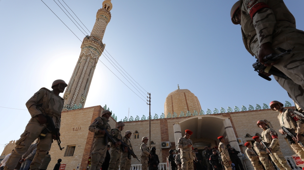 Military secure worshippers outside Al Rawdah mosque during the first Friday prayer after attack in Bir Al-Abed