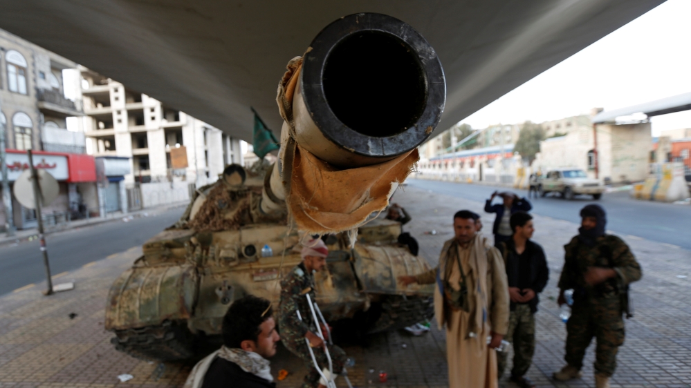 Houthi fighters stand by a tank after Yemen''s former president Ali Abdullah Saleh was killed, in Sanaa