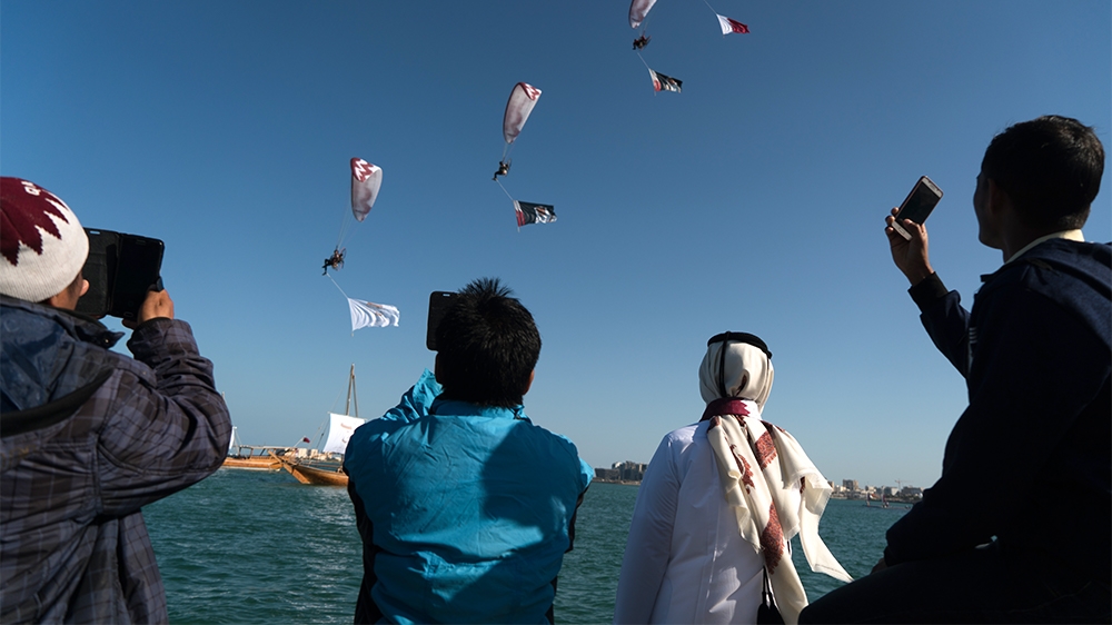 Locals and expats gathered to watch special events, including aerial displays and a military parade [Sorin Furcoi/Al Jazeera]