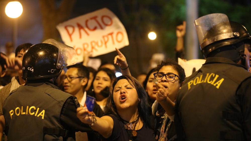 Protesters march near Centerio hospital after Peruvian President Pedro Pablo Kuczynski pardoned former President Alberto Fujimori in Lima