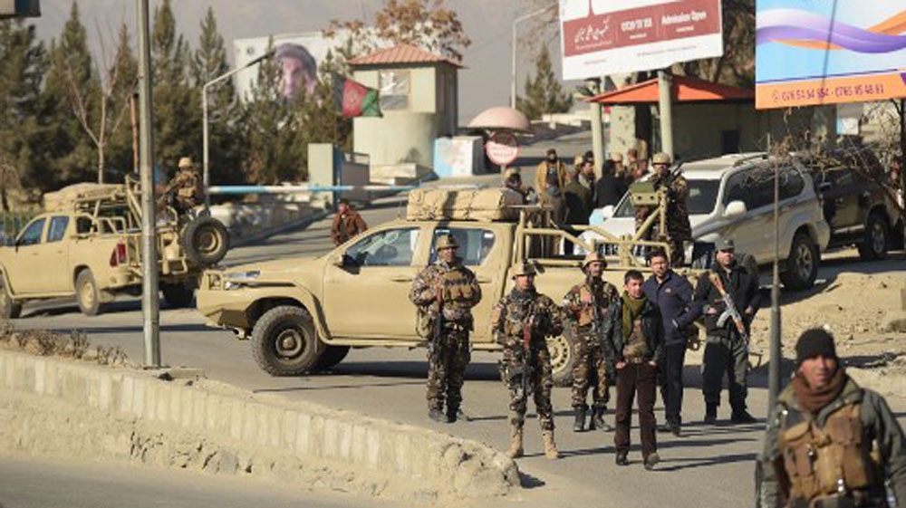 Gunmen stormed a luxury hotel in Kabul killing at least six people, including a foreigner, in a twelve-hour fight with security forces [Shah Marai/AFP]