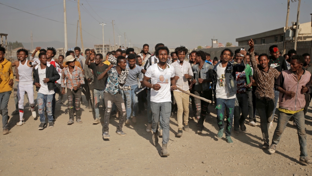 Supporters celebrate as they welcome Merera Gudina, leader of the Oromo Federalist Congress party after his release from prison in Addis Ababa