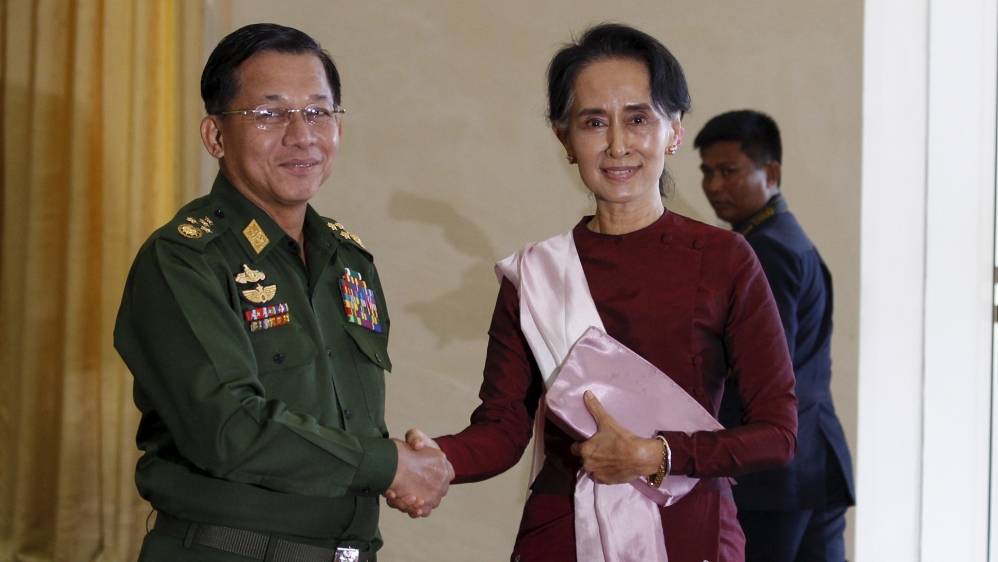 Senior General Min Aung Hlaing, Myanmar''s commander-in-chief, shakes hands with National League for Democracy (NLD) party leader Aung San Suu Kyi before their meeting in Hlaing''s office at Naypyitaw