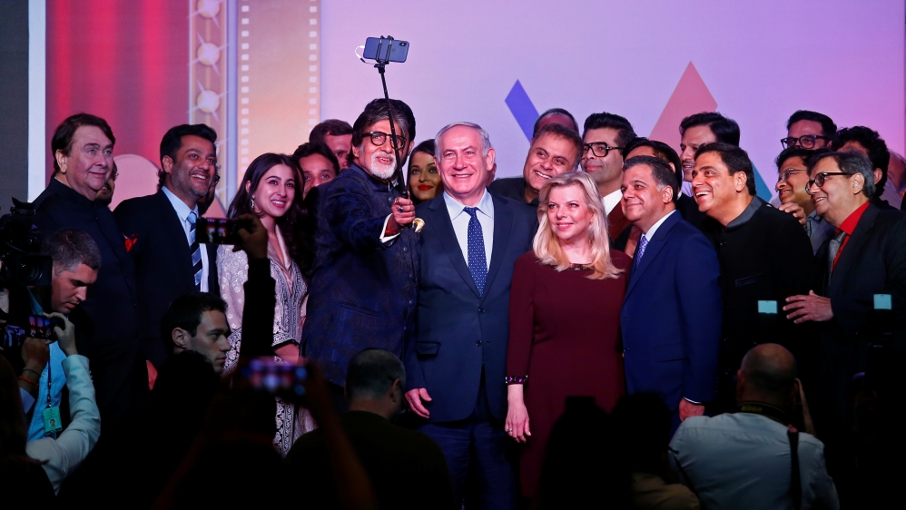 Bollywood actor Amitabh Bachchan takes a photo with Israeli Prime Minister Benjamin Netanyahu, his wife Sara and other Bollywood personalities during "Shalom Bollywood" event in Mumbai