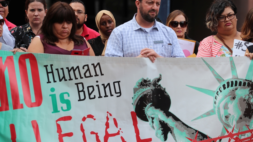 Immigration protest Reuters " no human being is illegal"