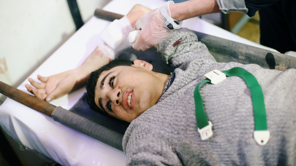 A man reacts as he lies on a stretcher at a medical point in the besieged town of Douma, Eastern Ghouta, Damascus, Syria February 20, 2018. REUTERS/Bassam Khabieh TEMPLATE OUT