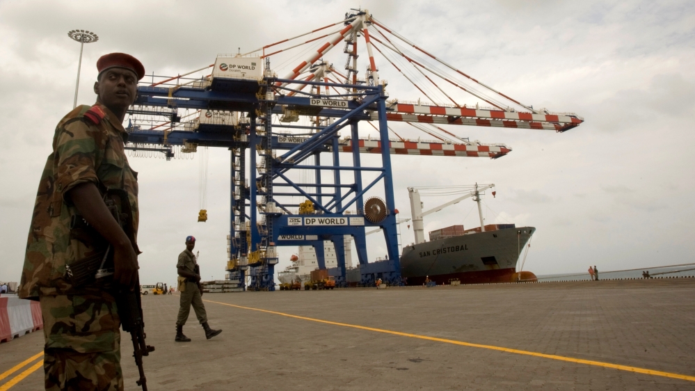 FILE PHOTO: A Djibouti policeman stands guard during the opening ceremony of DP World''s Doraleh container terminal in Djibouti port