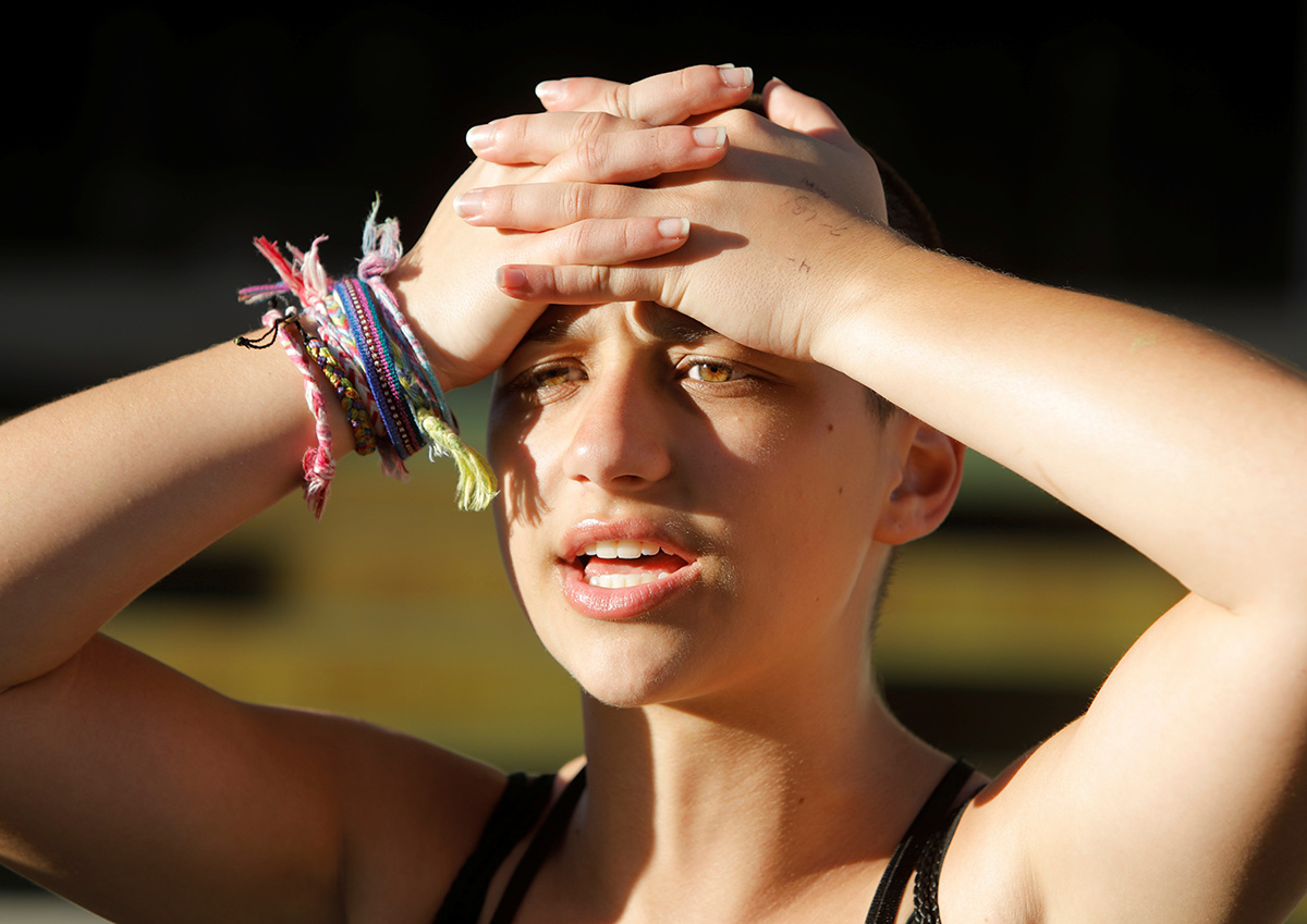 Emma Gonzalez, a senior at Marjory Stoneman Douglas High School, speaks to the media after calling for more gun control at a rally three days after the shooting at her school, in Fort Lauderdale, Flor