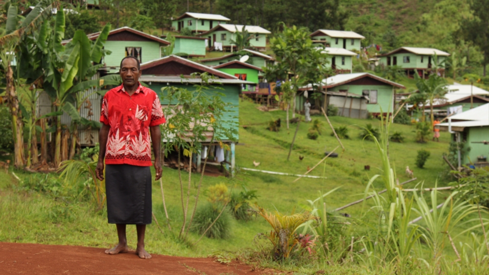 Sailosi Ramatu in front of Vunidogoloa's new site [Loes Witschge/Al Jazeera]