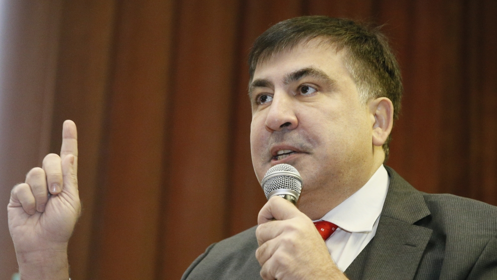 Ukrainian opposition figure and Georgian former President Mikheil Saakashvili delivers a speech as he attends a court hearing in Kiev