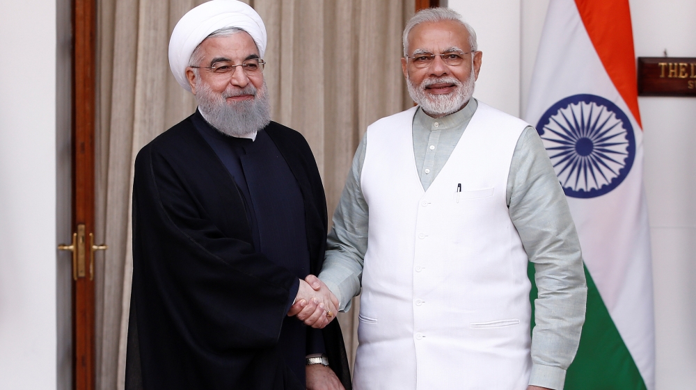 Iranian President Hassan Rouhani shakes hands with India''s Prime Minister Narendra Modi (R) during a photo opportunity ahead of their meeting at Hyderabad House in New Delhi