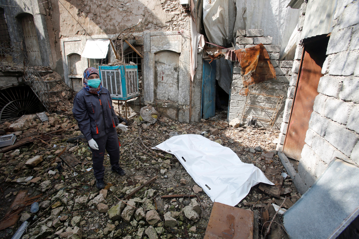 Suror Abdel Karim, a female activist and a nurse from Mosul''s Old City, collects the remaining bodies of the Islamic State militants, in Mosul, Iraq February 28,2018. Picture taken February 28, 2018.
