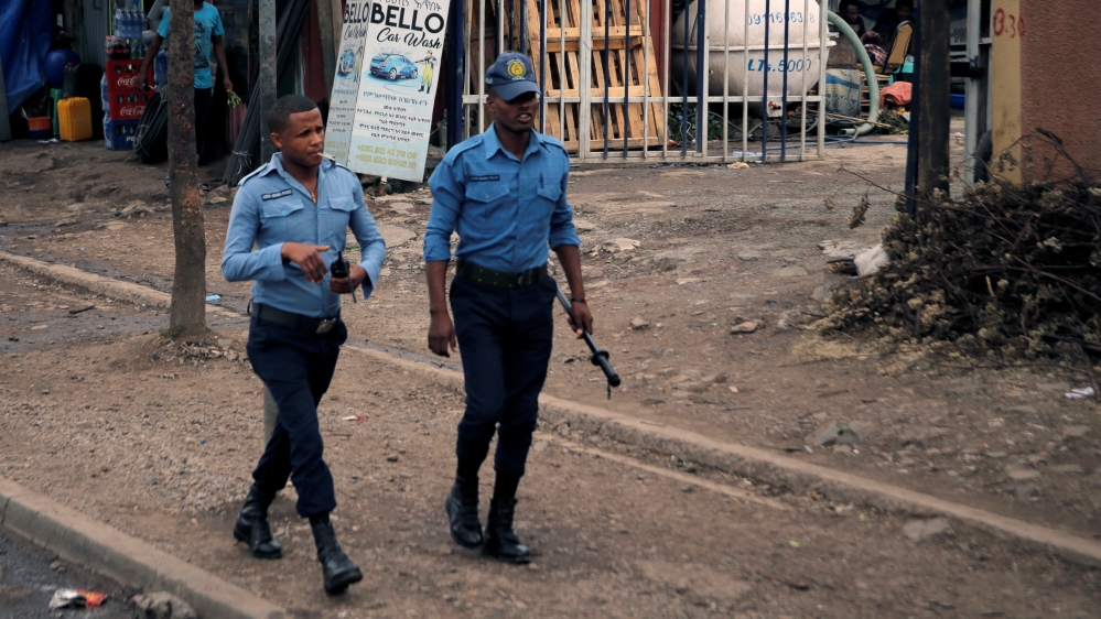 Police patrol along a road in Addis Ababa