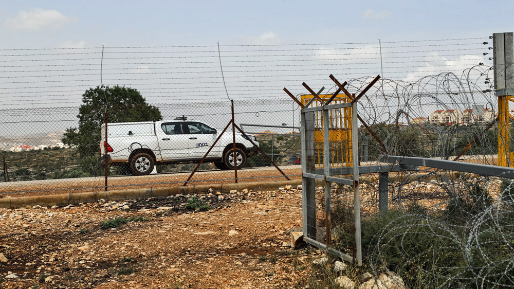 A view of the electric separation fence in Salfit, which Israeli security forces constantly patrol [Jaclynn Ashly/Al Jazeera]