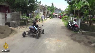With the help of friends and family, Dzoel built a specially designed vehicle to help him get from job to job [Screengrab/Al Jazeera]