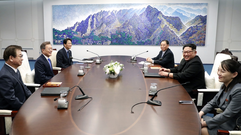 Sitting to the left of Kim Jong-un is his sister Kim Yo-jong, who visited South Korea during the Pyeongchang Winter Olympics in February [Korea Summit Press Pool via Anadolu]