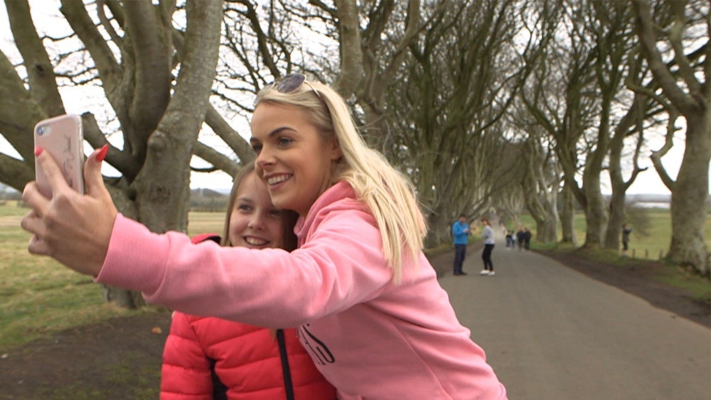 Tourists at the Dark Hedges in Ireland