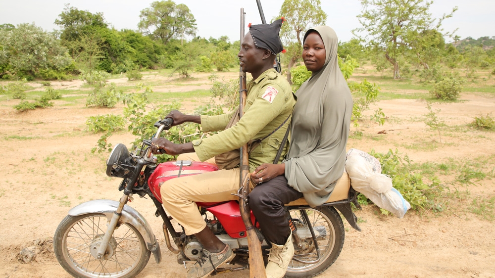 Aisha was the first woman to join the band of hunters. There are now several women tracking and capturing Boko Haram fighters [Rosie Collyer/Al Jazeera]