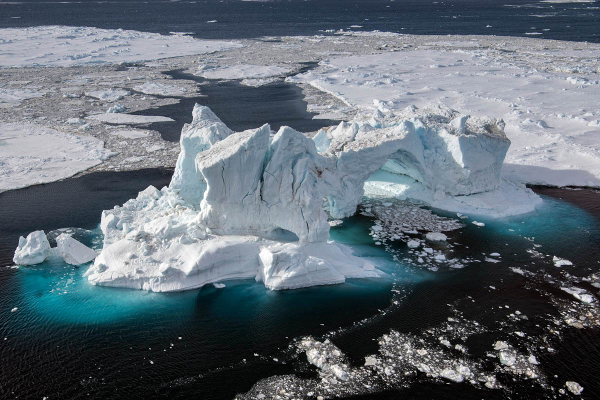 A helicopter’s eye view of the sheer scale and majesty of ice formations in Antarctic waters. This giant iceberg was once part of the Antarctic ice sheet, now broken off and slowly melting into the se