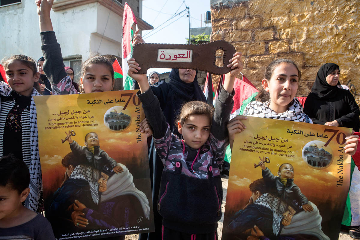 A Palestinian girl carries a wooden key with written on it "Return", Budrus. The right of return of Palestinian refugees is enshrined in by the UN General Assembly Resolution 194 passed on 11 December