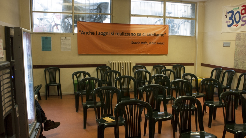 The waiting room in Naga's centre for migrants in Milan [Alessio Perrone/Al Jazeera]