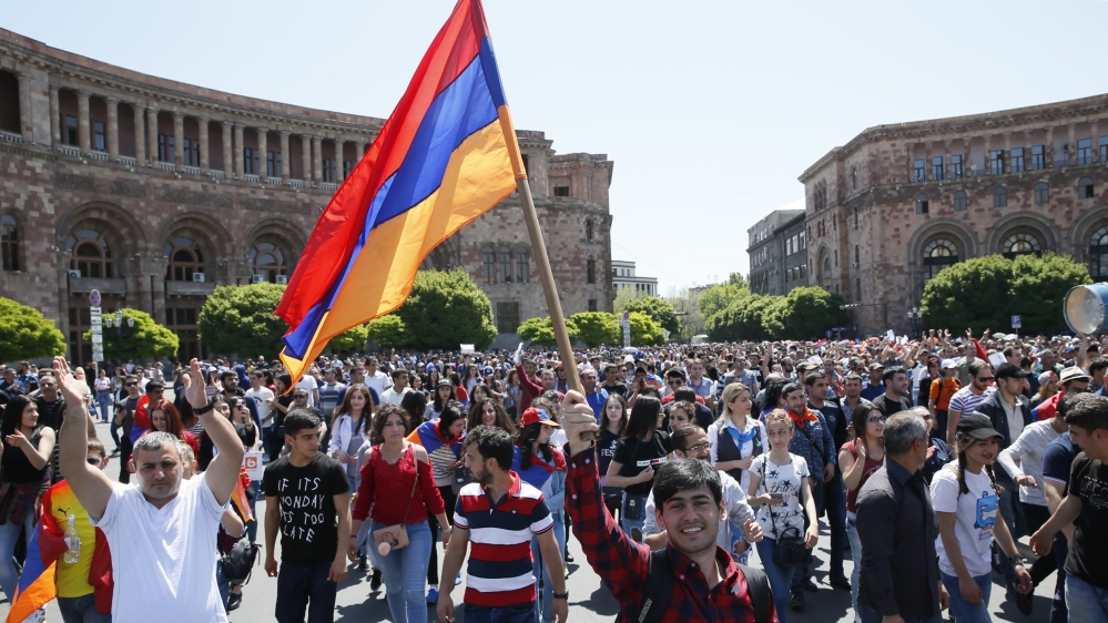 Armenian opposition supporters walk on the street after protest movement leader Nikol Pashinyan announced a nationwide campaign of civil disobedience in Yerevan