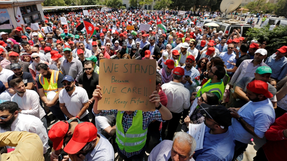 Protesters are seen gathered in front of the Labour Union offices in Amman