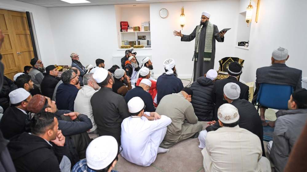 Worshippers listen to Iman Mufti Abdur-Rahman Mangera as they attend the opening [Jeff J Mitchell/Getty Images]