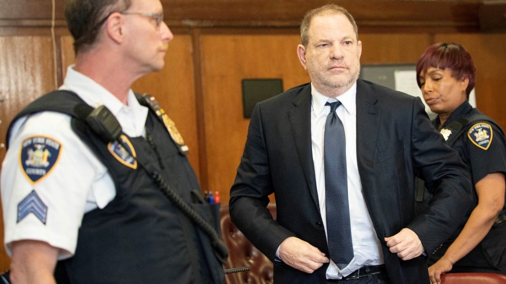 Film producer Harvey Weinstein stands inside Manhattan Criminal Court during his indictment in Manhattan in New York