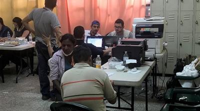 Garcia waits to identify the remains of her mother [Louisa Reynolds/Al Jazeera]