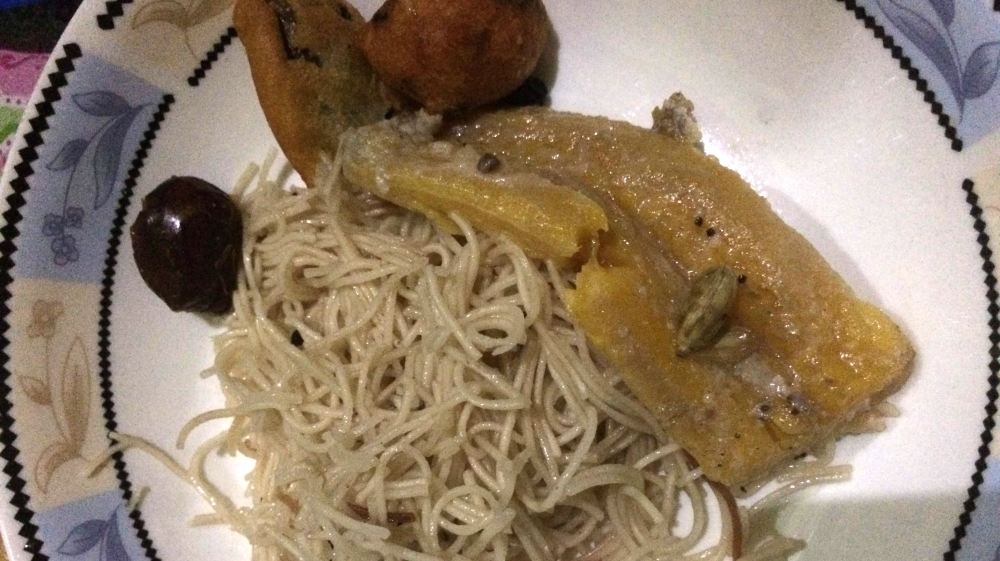 Tambi is made of fried vermicelli noodles and dark raisins simmered in sweet coconut milk with dashes of cardamom, vanilla and cinnamon [Amanda Leigh Lichtenstein/Al Jazeera]