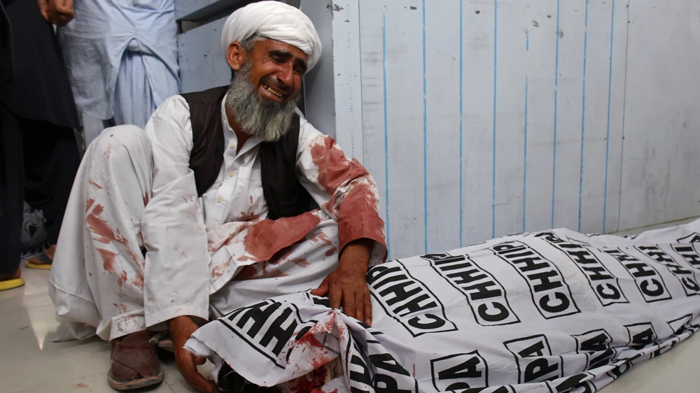 Survivors mourned the death of relatives who were killed in the attack [Naseer Ahmed/Reuters]