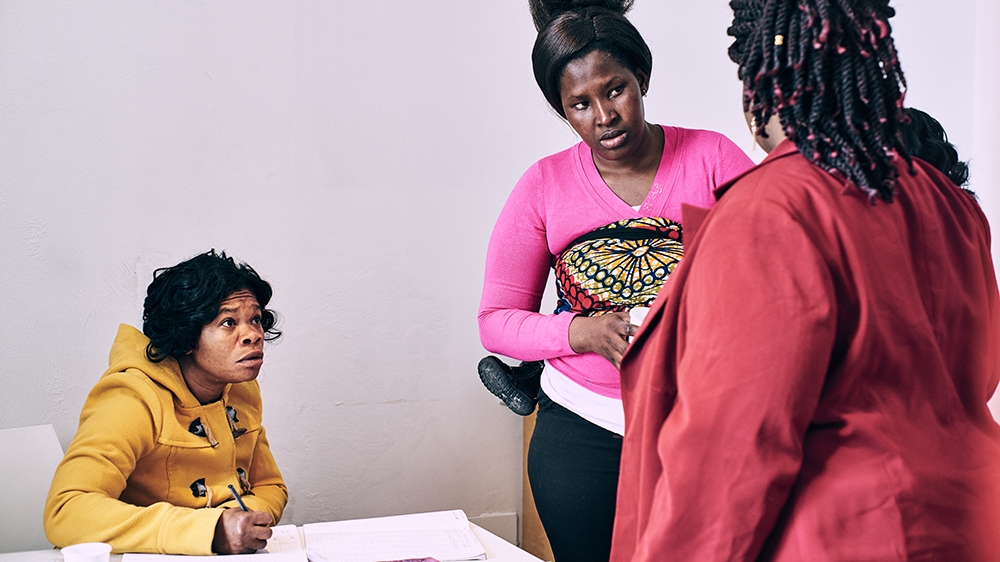  Sandra, centre, was a trafficking victim and was physically abused as a sex worker [Naomi Morello/Al Jazeera]