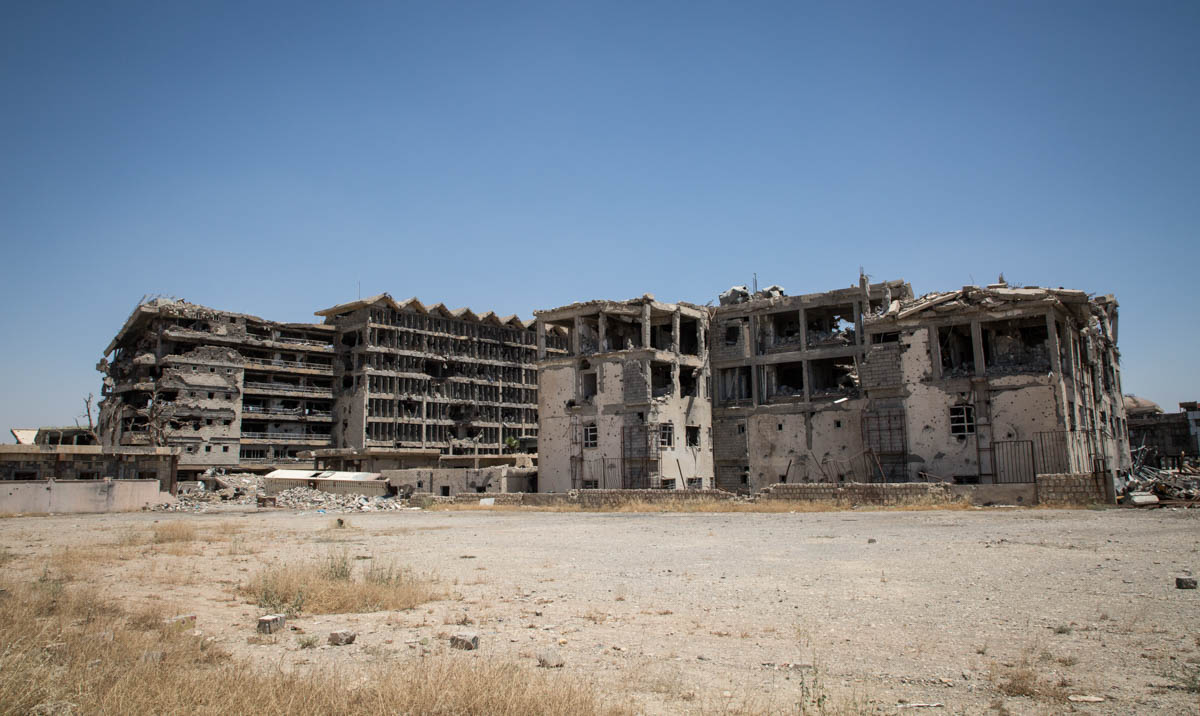 Photo 12 and 13 The remains of Mosul’s main hospital. One year on, most of the essential public infrastructures in the city are still destroyed. Photo: Tom Peyre-Costa/NRC. 03/07/2018 – West Mosul