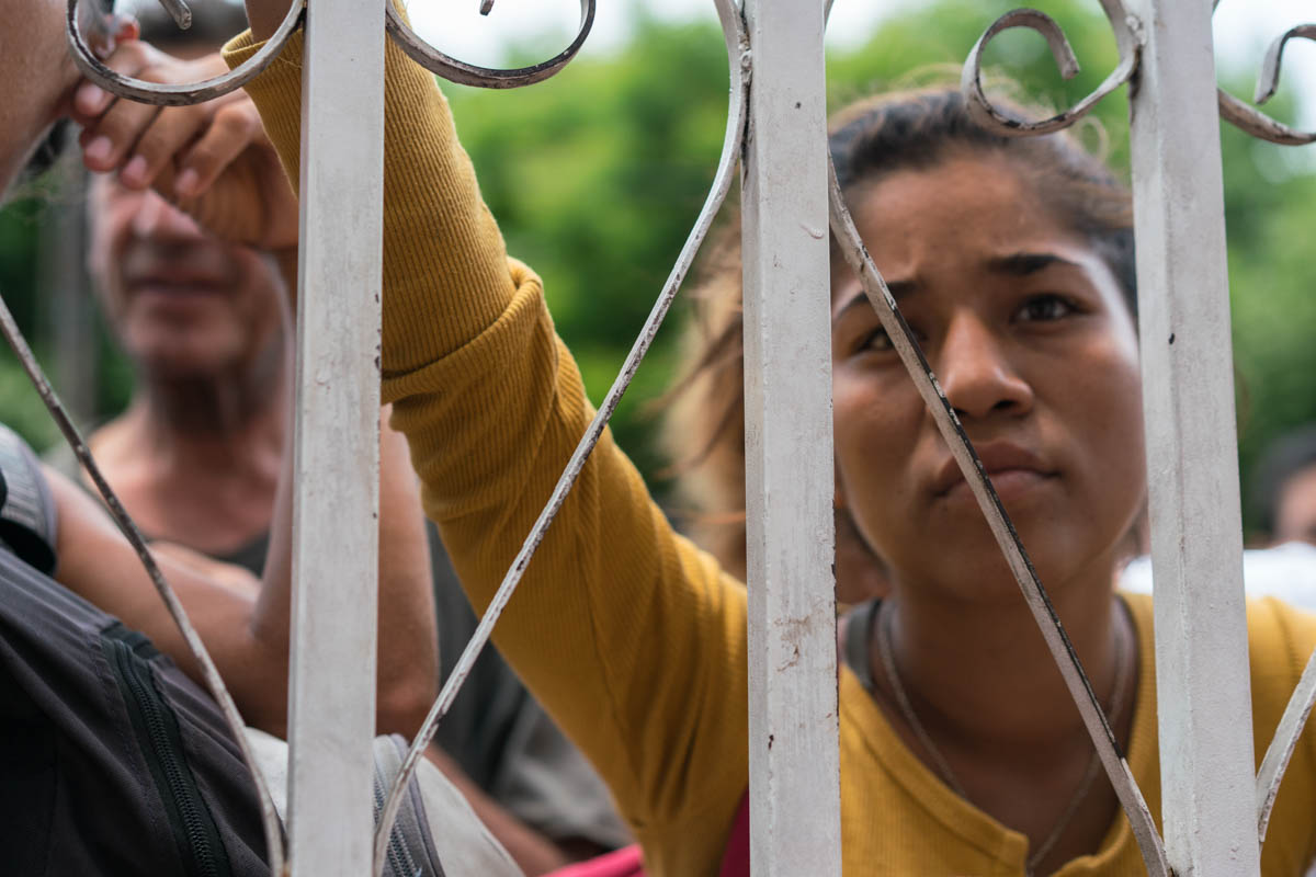 Colombians and Venezuelans wait for food distributions at a local soup kitchen. Approximately 35,000 Venezuelans are crossing into Colombia’s Norte de Santander department, where the border city of Cu