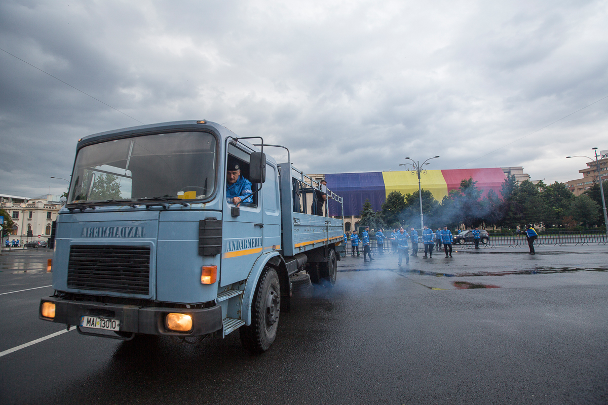 3. Gendarmes place fences ahead of a protest in the Victory Square in Bucharest, the main place where protests occur, where the headquarters of the Romanian Government is located.