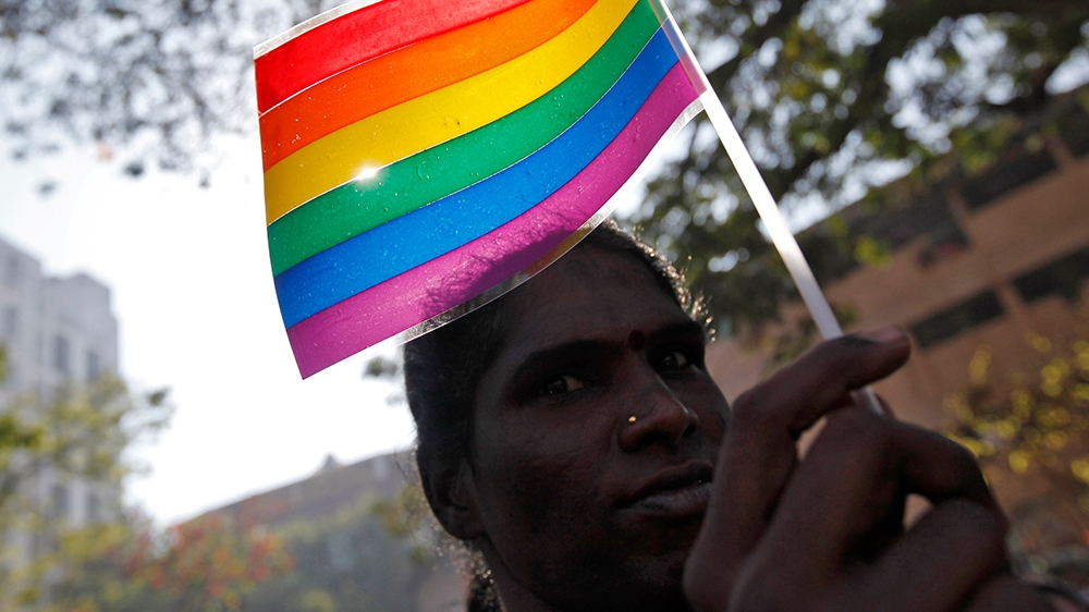 A participant holds a rainbow flag during Queer Azadi Mumbai 2011 (Queer Freedom Mumbai 2011), a parade for gay and lesbian rights, in Mumbai on January 29, 2011 [File: Danish Siddiqui/Reuters]