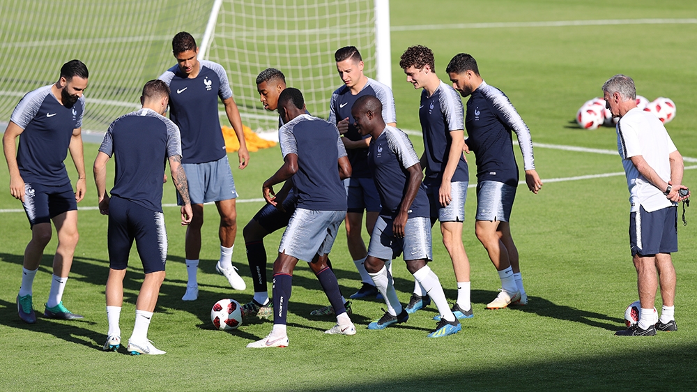 Manager Didier Deschamps, right, and the French team ahead of the 2018 FIFA World Cup match against Argentina [Sergei Savostyanov/TASS/Getty]
