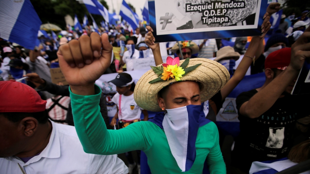 Students staged dueling marches for and against the government [Jorge Cabrera/Reuters]
