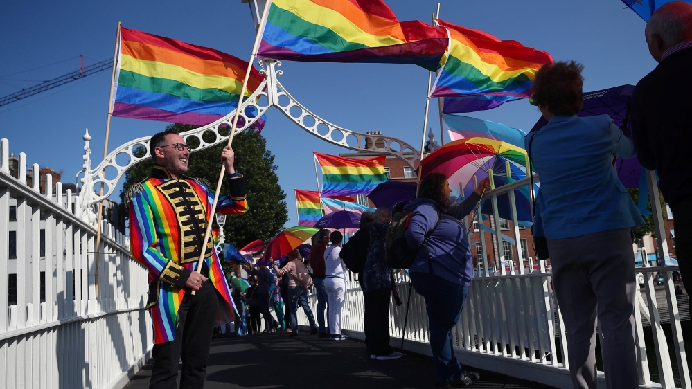 Protesters demonstrate on the Ha'Penny Bridge in Dublin during Pope Francis' visit [Hannah McKay/Reuters]