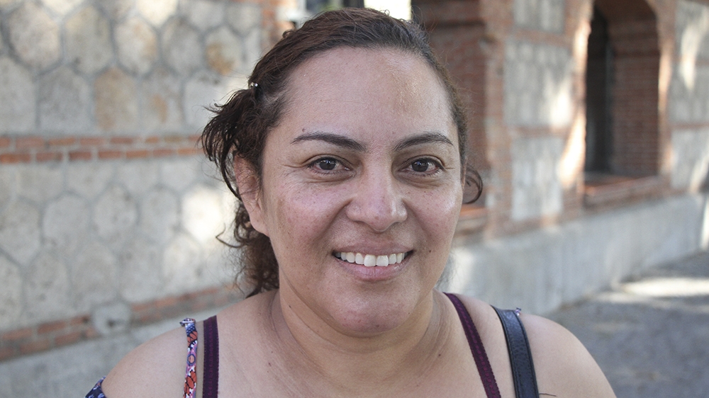 Dilcia was made redundant while recovering from back pain, which she endured as a result of arduous hotel cleaning work [Santiago Saez/Al Jazeera]