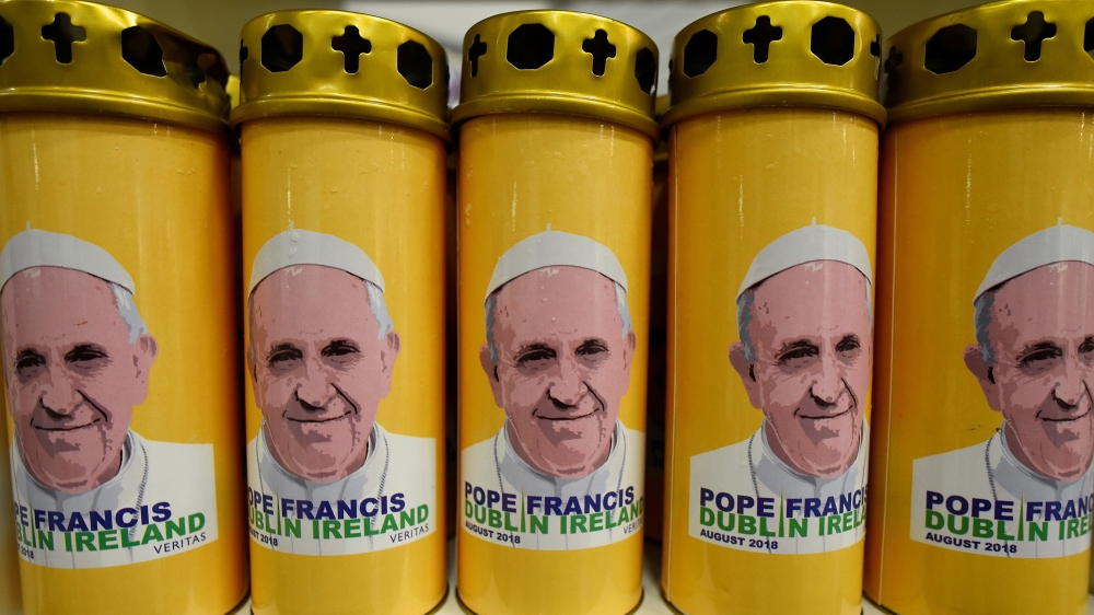 Candles with a picture of Pope Francis on sale at a stall in Dublin [Clodagh Kilcoyne/Reuters]
