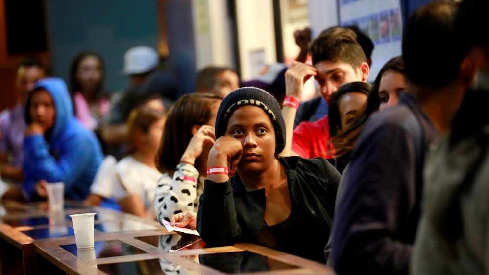 The pace of departures has accelerated in recent days [Douglas Juarez/Reuters]